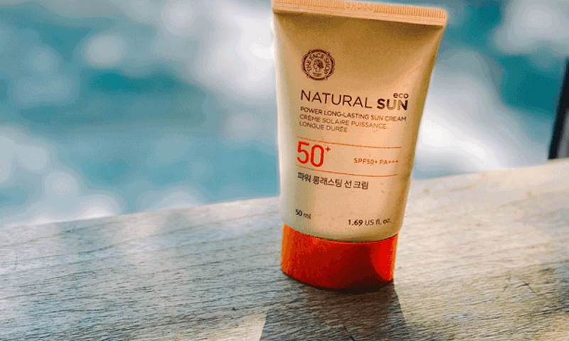 Sunscreen sitting on a pool ledge
