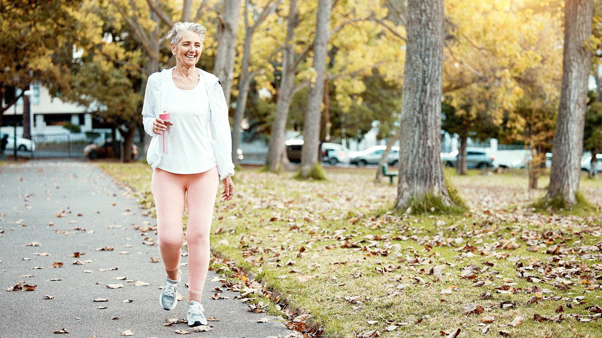 senior woman walking in the park.jpg