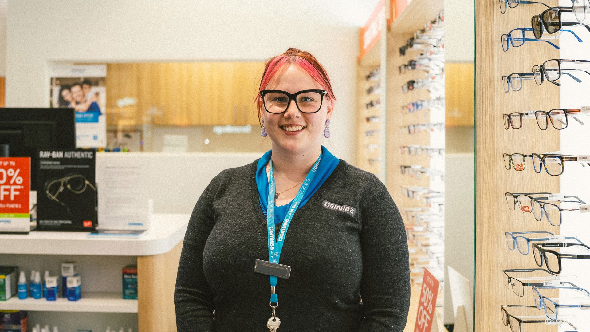 GMHBA Eye Care Geelong retailer worker standing in front of store