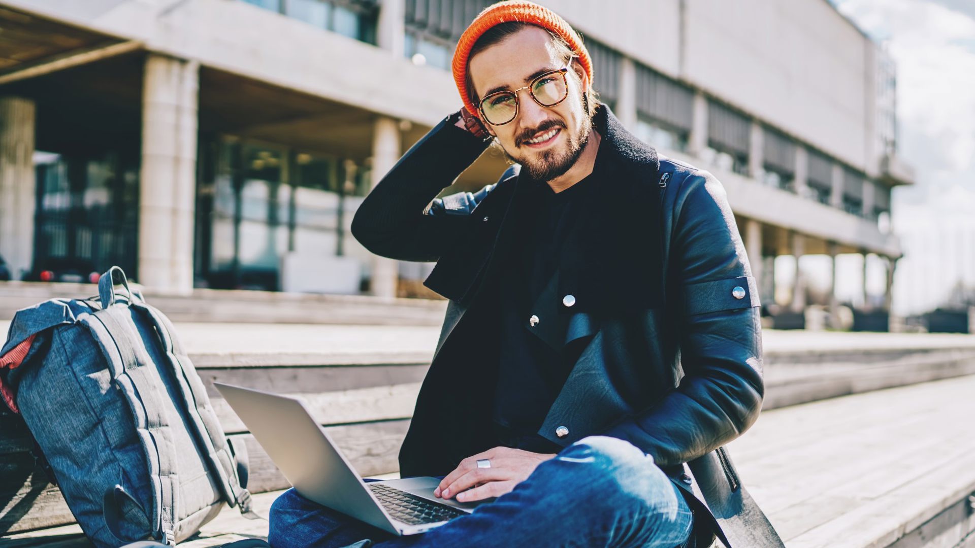 Man wearing glasses looking at computer