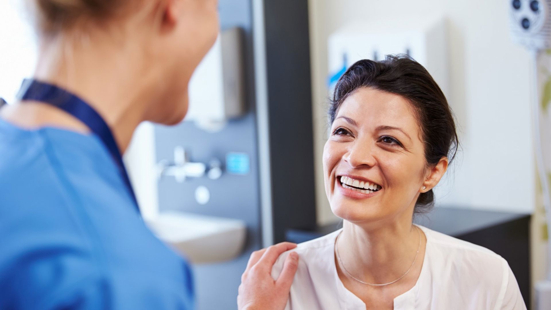 Woman receiving consult at GMHBA Hub