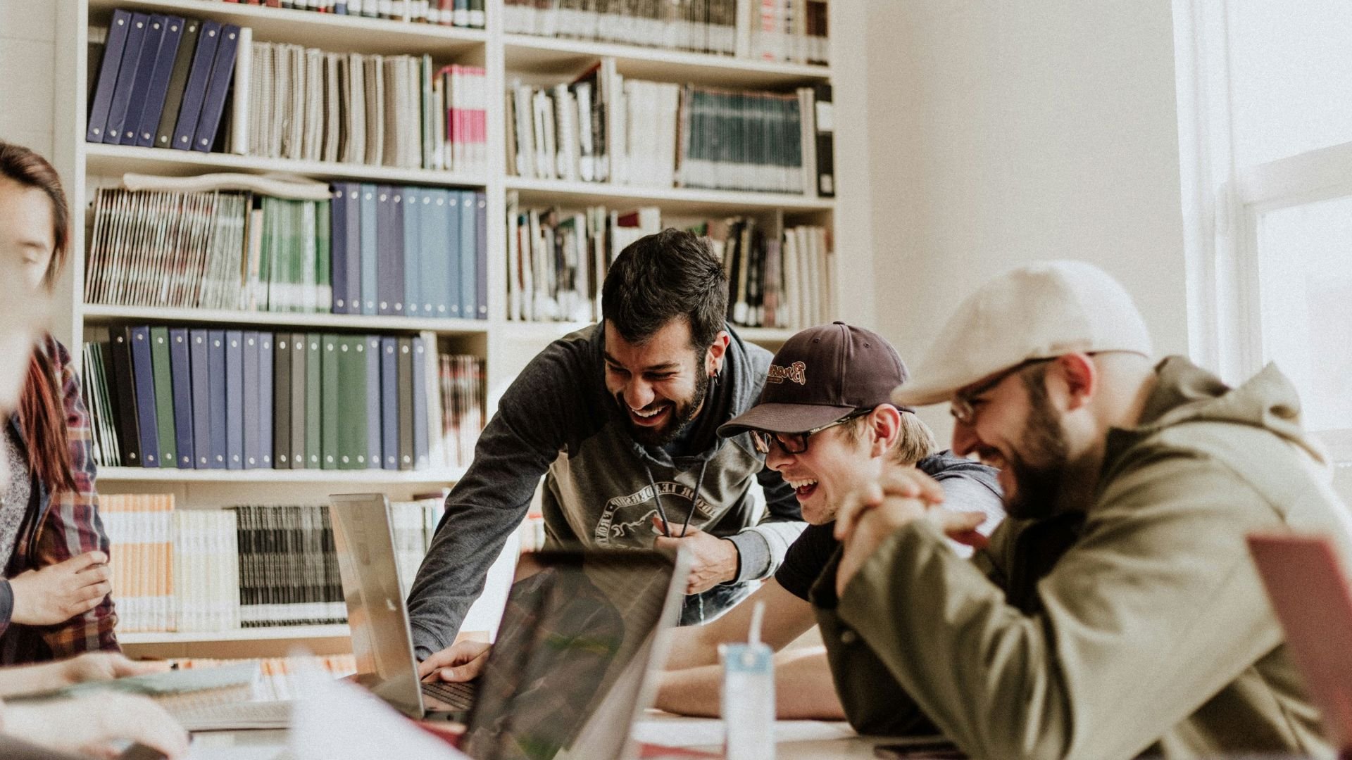young guys looking at health insurance laughing