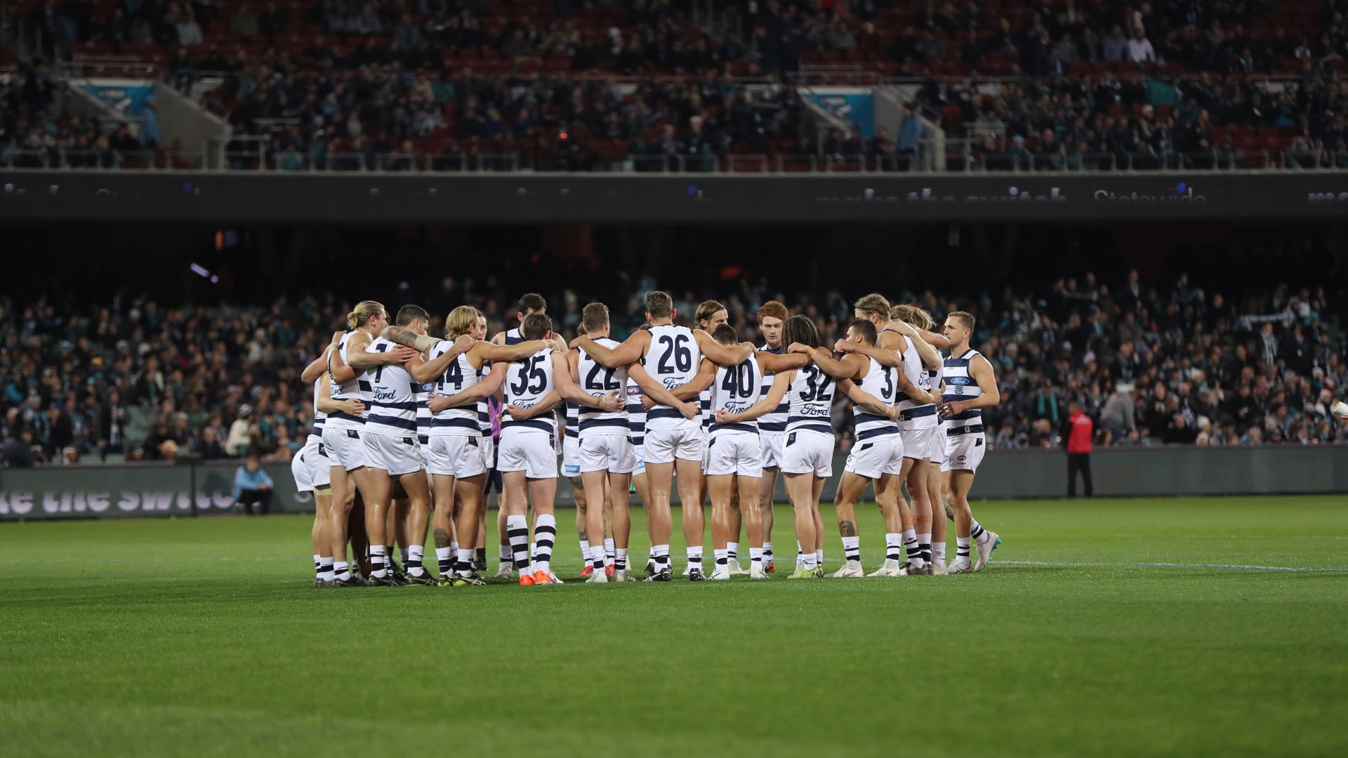 Geelong team huddled together