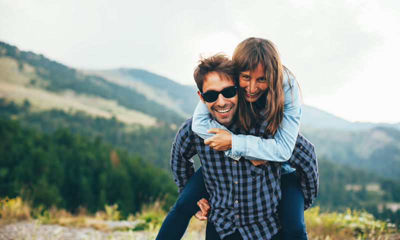 Girl getting a piggy back from her bpyfriend