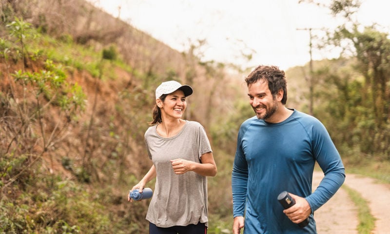 Smiling couple exercising outdoors